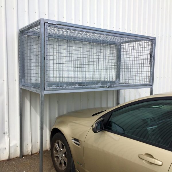 Galvanised Over Bonnet Storage Cage against white corrugated wall with gold sedan car parked underneath